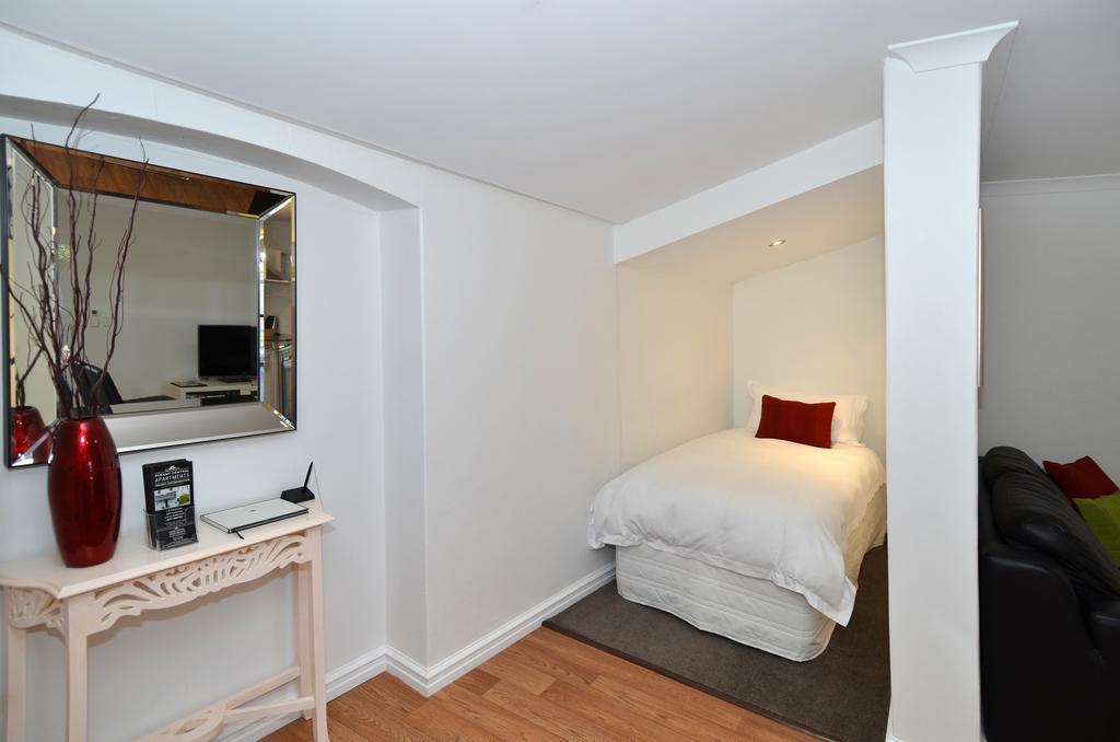 Albany Central Apartments Rum bild